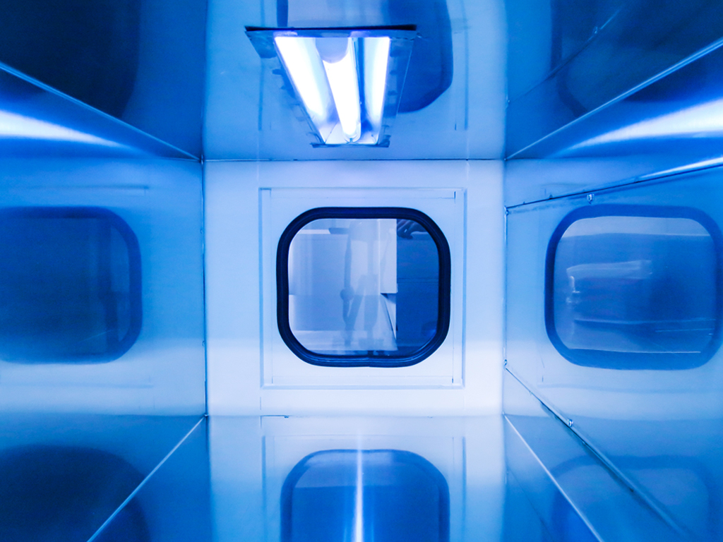 UV light glows Inside a laboratory UV disinfection chamber