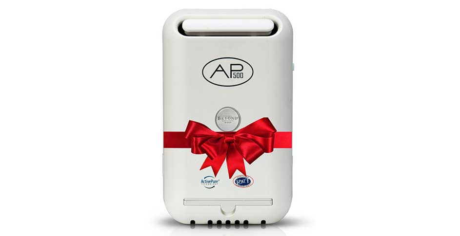 ActivePure AP 3000 wrapped with a bow, a plug in air purifier that combats airborne pathogens.
