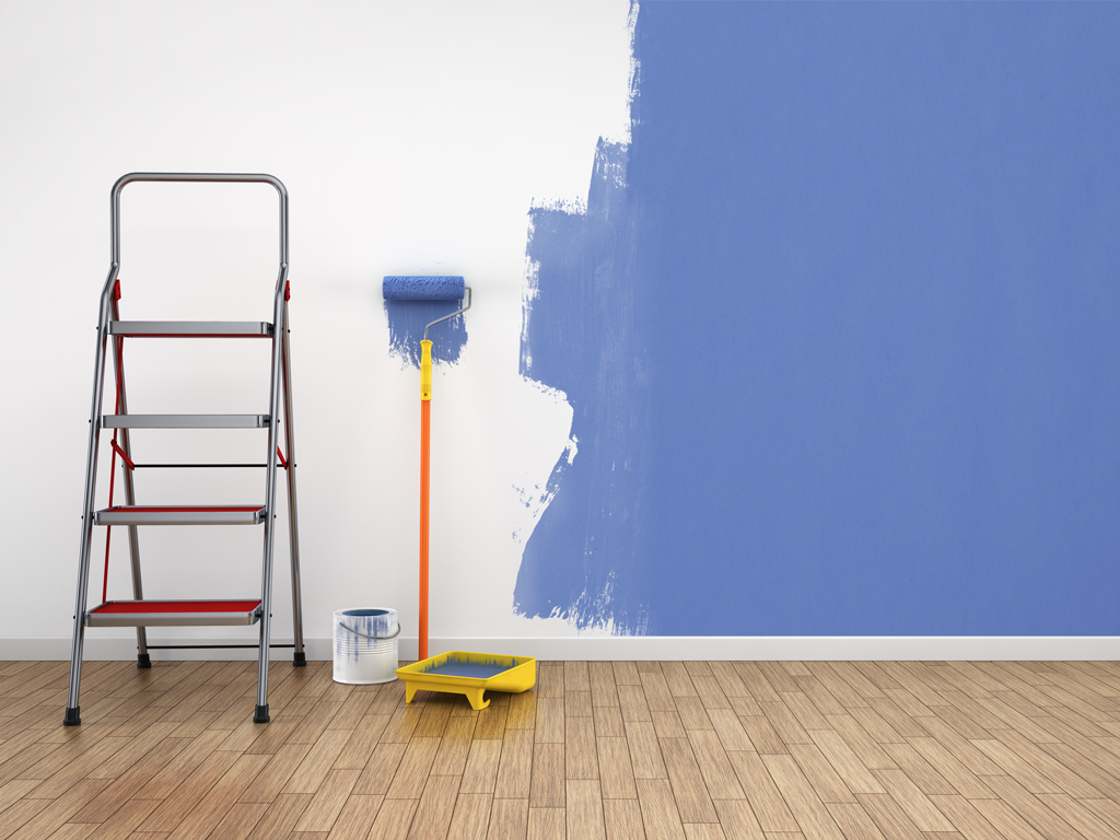 A ladder and paint roller next to a wall, some paint is supposed to help with air purification but is not as effective as one may think.